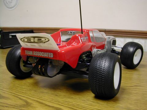 1994 Ford Bronco - Remote control buggy with "TEAM ASSOCIATED" graphics on the rear wing.