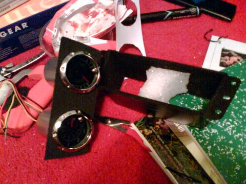 1997 Ford Probe - Dashboard trim piece with two gauges and wiring, likely for aftermarket installation.