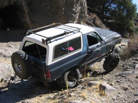 1986 Ford Bronco - This modified Ford Bronco navigates a challenging rocky terrain.
