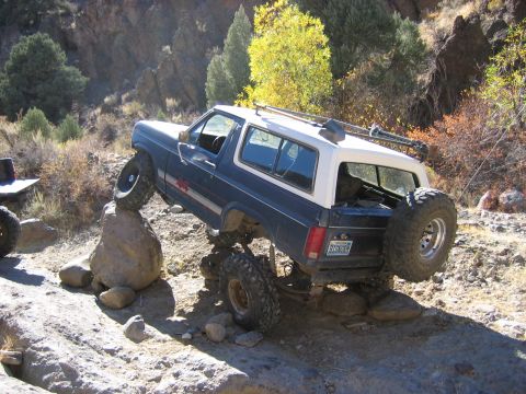 1986 Ford Bronco - This 1986 Ford Bronco navigates a rocky trail, its off-road capabilities.