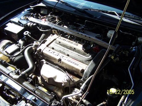 1997 Mitsubishi Eclipse - Close-up view of the engine compartment, highlighting the DOHC 16 valve engine.
