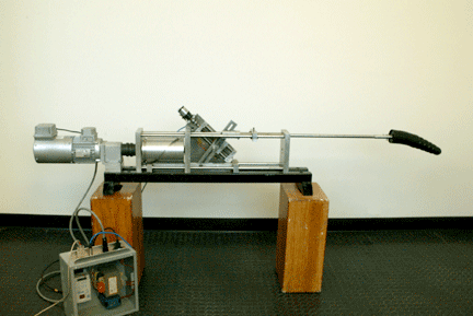 1991 Ford Bronco - A complex mechanical device is set up on wooden supports against a white wall.