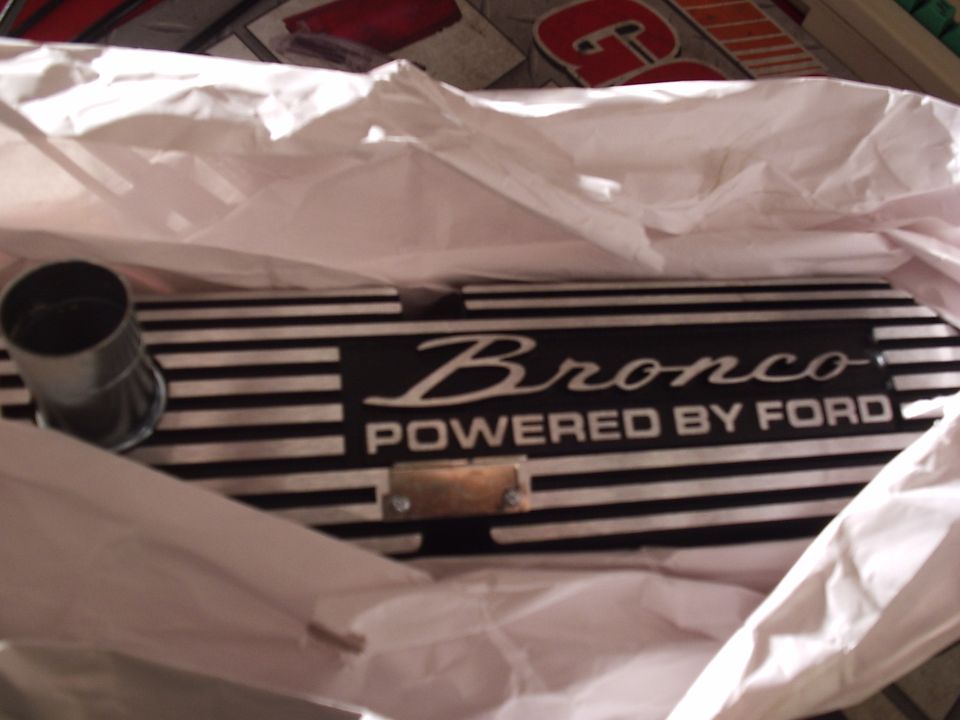 Finned aluminum valve cover engraved Bronco Powered by Ford in white tissue packaging