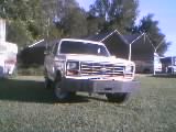 1986 Ford Bronco - This 1986 Ford Bronco is seen from the front, an aftermarket bumper and a white exterior.