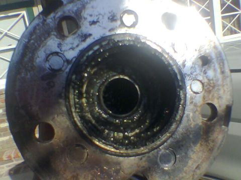 1988 Ford Bronco - This image shows a close-up view of a wheel hub assembly, likely needing replacement due to visible wear and grease.