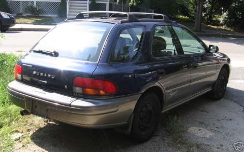 1997 Subaru Impreza - This Subaru Impreza wagon is seen from the rear, parked on a sunny day.
