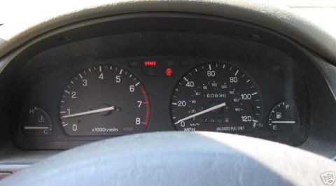 1997 Subaru Impreza - Interior view of a car's dashboard gauges, including the speedometer and tachometer.