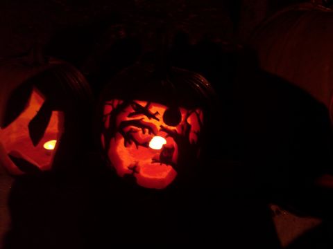 2001 Ford Crown Victoria - Carved pumpkins glow with candlelight, creating a festive Halloween scene.