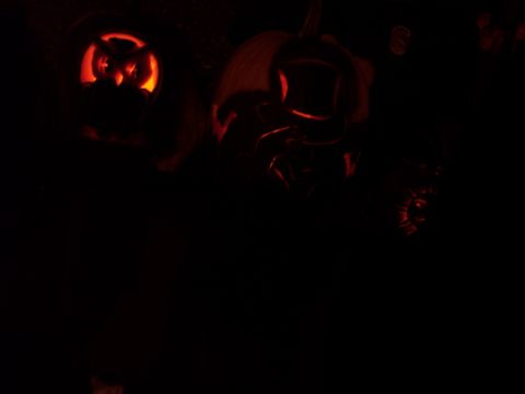 2001 Ford Crown Victoria - Several carved pumpkins are illuminated from within, creating a spooky Halloween display.