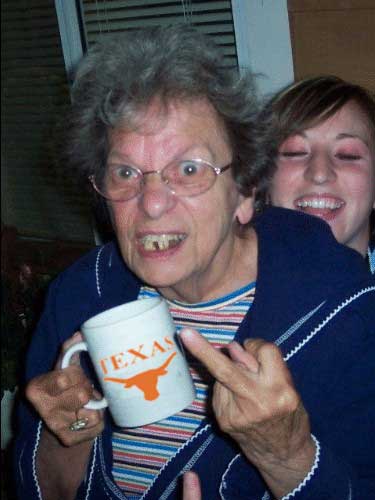 1993 Ford Bronco - A woman expresses her feelings with a mug and a gesture, while a friend smiles behind her.