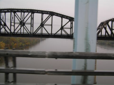 1997 Subaru Impreza - A view of a bridge crossing a river on a foggy day.