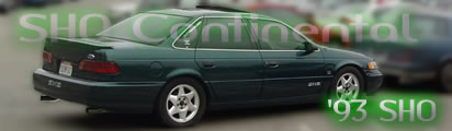 1993 Ford Taurus - This 1993 Ford Taurus SHO is viewed from the rear 3/4 angle, showing its distinctive body style and wheels.