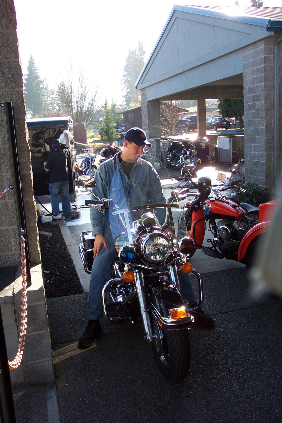 2005 Harley-Davidson FLH motorcycle with blue lights and a windshield