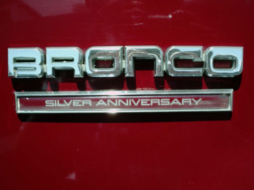 Chrome Bronco emblem with Silver Anniversary badge on dark red paint