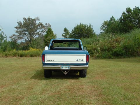 1979 Ford Bronco - This 1979 Ford F-Series truck is viewed from the rear, showing its 4x4 designation and Ford badging.