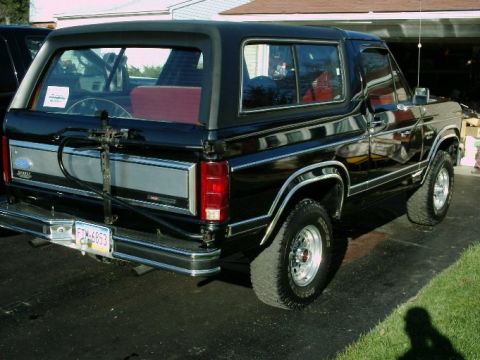1984 Ford Bronco - This 1984 Ford Bronco is shown from the rear, its distinctive spare tire carrier mounted externally.