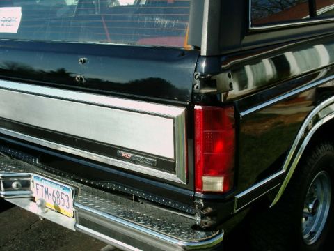 1984 Ford Bronco - Rear view of a 1984 Ford Bronco showing the XLT trim and taillight assembly.