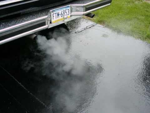1984 Ford Bronco - Vehicle exhaust emitting smoke, with a Pennsylvania license plate visible.