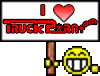 1992 Ford Bronco - A sign with a heart and text is held by a cartoon smiley face.