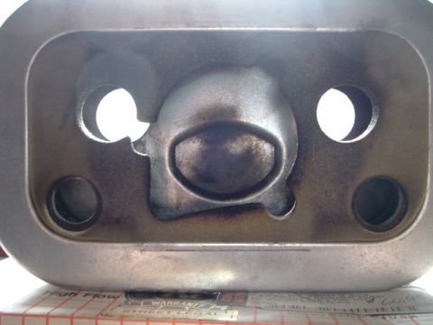 2002 Harley-Davidson Sportster Custom - This is a close-up view of a motorcycle engine component, possibly a cylinder head or intake manifold.