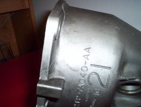 1992 Ford Crown Victoria - Close-up of a metal casting showing part numbers and a large numeral 21.