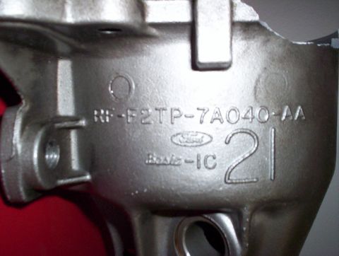 1992 Ford Crown Victoria - Close-up of a metal engine component displaying the Ford logo and a part number.