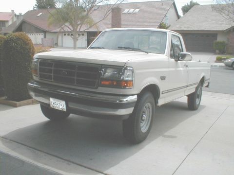 1992 Ford F-250 - White 1992 Ford F-250 pickup truck with a chrome bumper and grille.