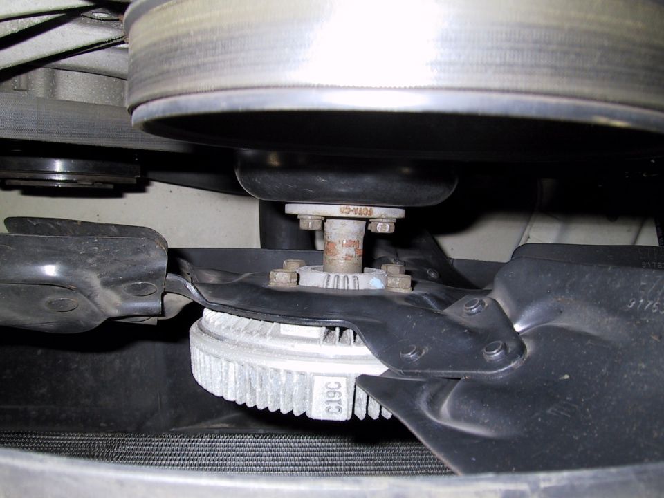 Engine fan clutch with visible part number C19C, attached to a pulley system