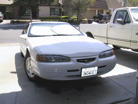 1997 Ford Thunderbird - Front view of a 1997 Ford Thunderbird parked in a driveway.