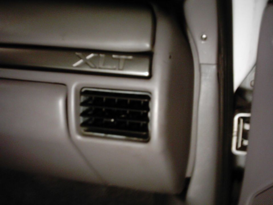 Interior dashboard trim with XLT badge and air vent