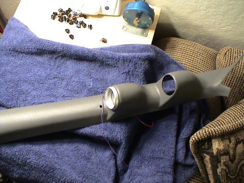 1997 Ford Probe - Interior gauge pod with two circular openings and visible wiring, resting on a blue towel.