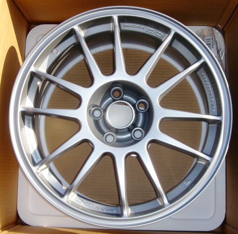 OZ Racing wheel in a box. Text on wheel reads "OZ RACING" and "SUPERLEGGERA"