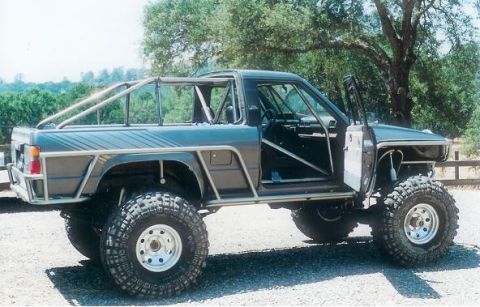 1991 Ford Bronco - This heavily modified pickup truck features a custom roll cage and oversized tires.