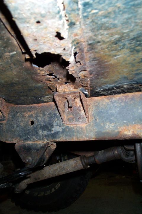 1954 Jeep Wrangler - Severe rust damage on vehicle frame and undercarriage components.