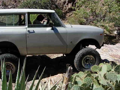 1981 Ford F-150 - An International Harvester Scout II navigates a , rocky desert landscape.