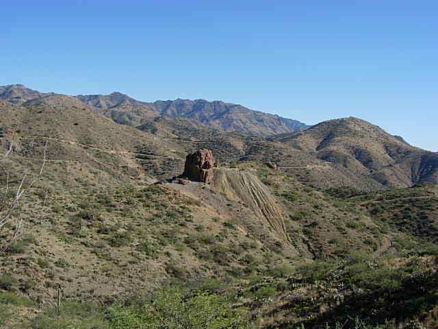Desert mountain scene with a prominent rock formation