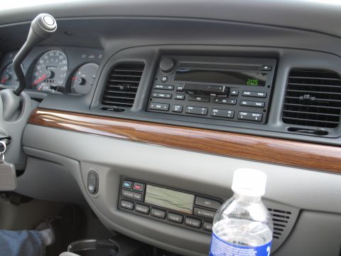 2003 Ford Crown Victoria - Interior view of a 2003 Ford Crown Victoria, showing the dashboard, radio, and climate controls.
