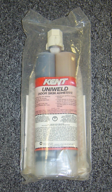1986 Ford Bronco - A tube of Kent UniWeld Door Skin Adhesive is shown, packaged in plastic.
