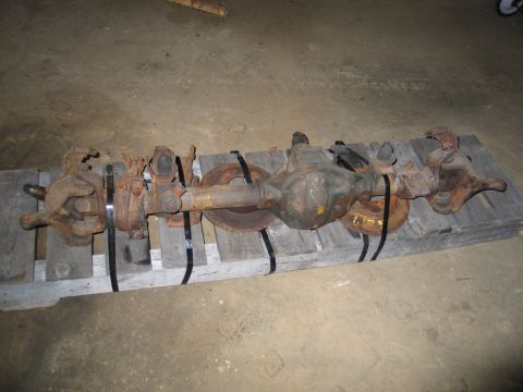 1995 Ford Bronco - This is a Ford Dana 44 axle assembly, likely for a truck or SUV, shown on a pallet.