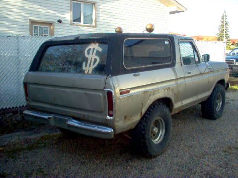 1979 Ford Bronco - Rear 3/4 view of a 1978 Ford Bronco with a dollar sign sticker on the window.
