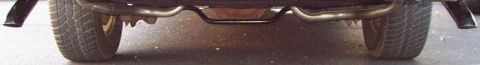1985 Ford LTD Crown Victoria - The rear bumper and dual exhaust pipes are visible in this close-up shot.