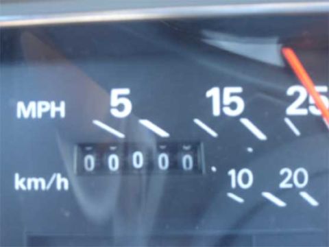 1988 Ford LTD Crown Victoria - Close-up of a car's speedometer and odometer. The odometer shows 00000 miles.