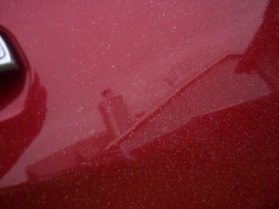 1972 Ford Ranchero - The red paint on this vehicle has a speckled appearance, possibly from glitter or dust.