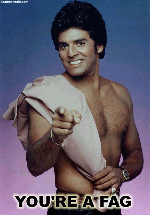 1987 Ford Bronco - A man points directly at the camera with a smile, wearing a pink cloth over his shoulder.