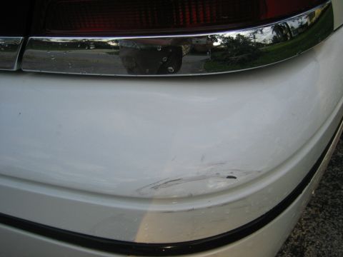 1999 Ford Crown Victoria - Scuff on right side of back bumper...
