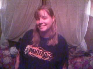 1986 Ford Bronco - A woman smiles while wearing a black t-shirt with a band logo.