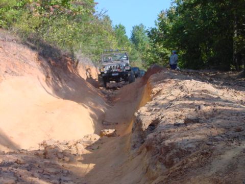 2004 Jeep Wrangler - Jeep TJ navigating a challenging off-road trail with a second Jeep following.