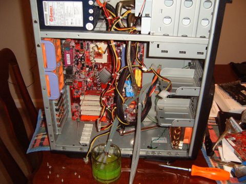 1988 Ford Bronco - Computer internals are visible, with a glass of green liquid and tubes connected.