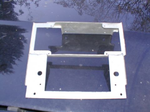 1979 Ford Bronco - This metal bracket appears to be a replacement part, likely for a vehicle's front end.