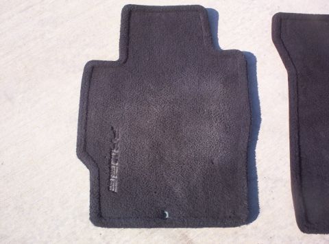1994 Ford Probe - Black car floor mats with embossed 'PROBE' text are shown, likely for a Ford Probe.